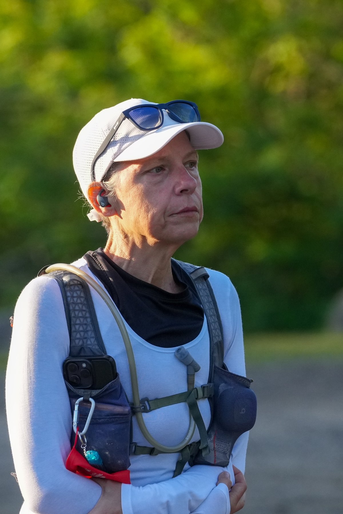 Sharon Woodill in running gear, standing quietly in morning light before a run